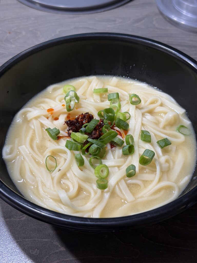 Bowls of noodles with different toppings